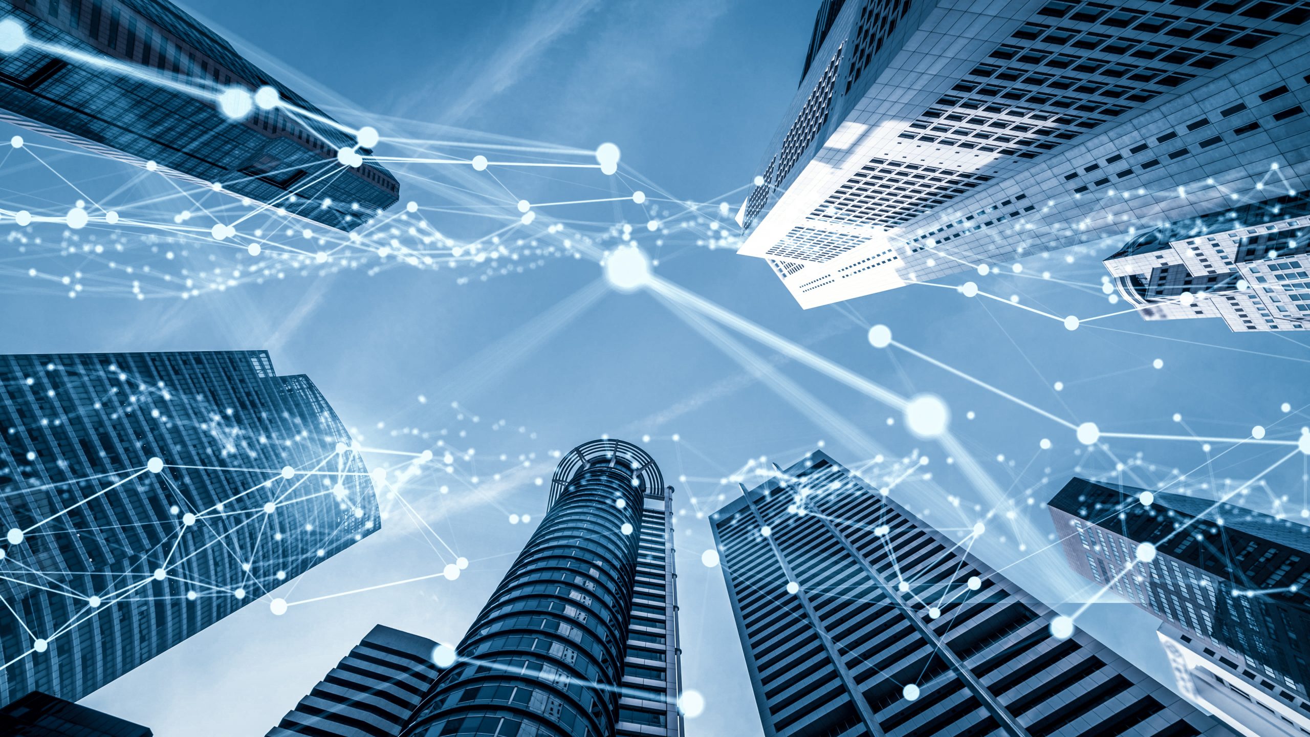 Connected smart buildings with IoT network overlay representing enterprise technology solutions